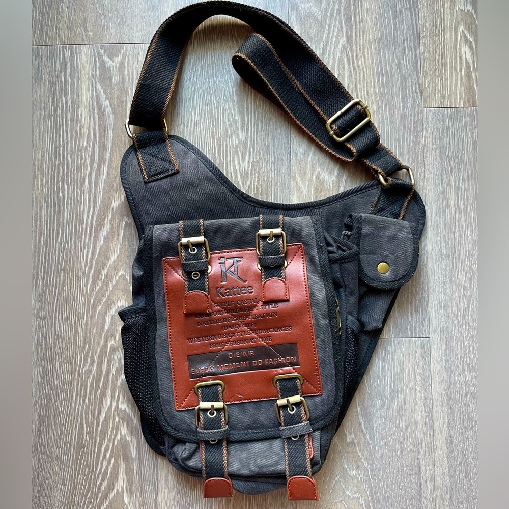 Kattee vintage saddle style leather and canvas crossbody bag.